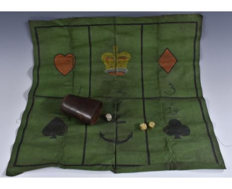 A late 19th century sailor's gambling game, Crown and Anchor, the green canvas board marked out with insignia and playing car