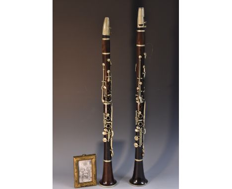 A 19th century clarinet, by Jacques Albert, Brussels, sold by W D Cubitt, London, stamped, plated keys, 65.5cm long; another,