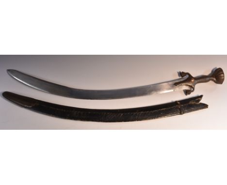 A 19th century Afghan tulwar or pulwar, 67cm curved blade with armourer's marks, the steel grip with lotus quillon, fluted di