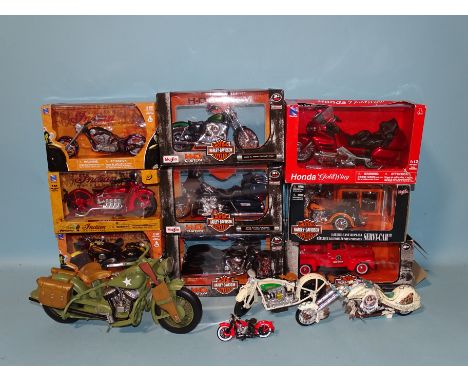 Eight boxed motorcycles by Maisto (4) and Newray (4), a Maisto Harley Davidson Fire Dept Ford pickup, two resin motorcycle mo