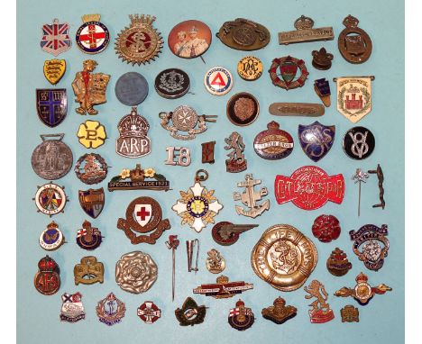 A silver ARP badge and various other enamel and plastic badges, (approximately 50). 