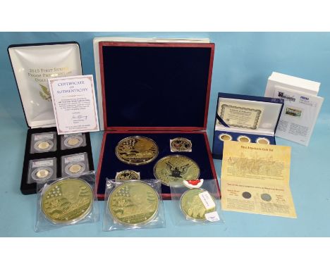 A 2015 cased set 'First Strike' Proof Presidential Dollars, a Morgan Mint 2000 Statehood Quarter Dollar five-coin cased set, 