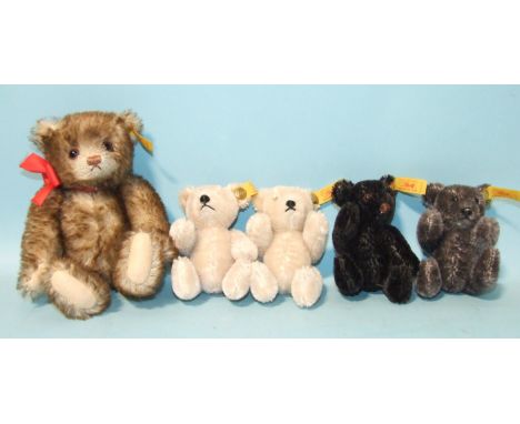 Four Steiff 10cm miniature teddy bears: cream (x2), black and grey, and one 16cm teddy bear, all with ear tags only, (5). 