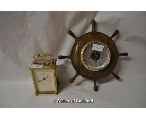 A modern carriage clock, dial marked Dominion, Made in England; a small aneroid barometer.