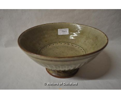 A stoneware footed bowl by Richard Batterham, green glaze with impressed fluted decoration, 11cm.