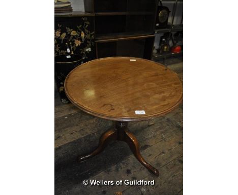 A 19th Century mahogany tripod table with moulded rim, 59.5 x 62.5cm.