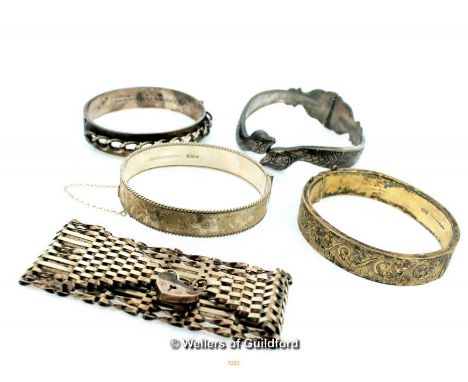 An assortment of Silver Bangles and a Silver Gate Chain Link Bracelet with Heart Padlock Clasp, 144g