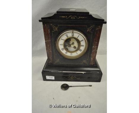 *A Victorian black slate and red marble mantel clock with visible Brocot escapement.