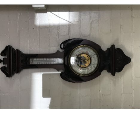 A Edwardian mahogany barometer with applied thermometer box .