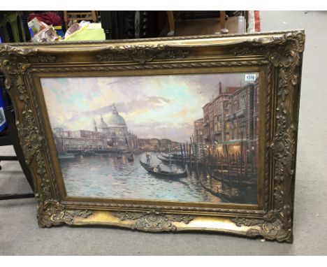 A large gilt framed and glazed print of Venice canals. 115 x 90cm