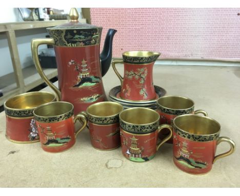 A Carltonware coffee set decorated with a oriental scene.
