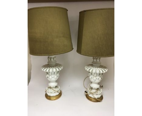 A pair of white glazed ceramic lamps with gilt wood bases and detachable shades hight 76cm