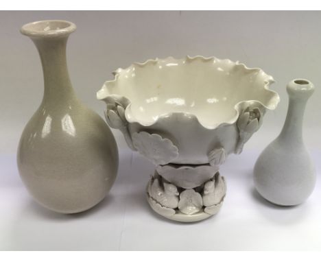 Three white glazed ceramic items including a decorative bowl and two vases, tallest approx 23.5cm.