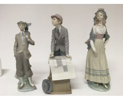 A collection of three Lladro figures a golfer a Surveyor and a lady in dress Appears to be in good condition approx height is