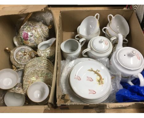 Five boxes containing a collection of ceramic items comprising an Oriental tea set and one other, three figural groups and ot