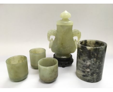 A jade vase and cover, one other jade vase and three vessels (5).