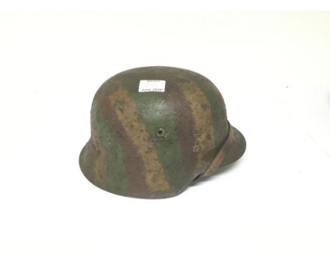 German M35 Combat helmet with rough painted camo, complete with liner