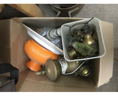 Five boxes containing oil lamp parts spares various.