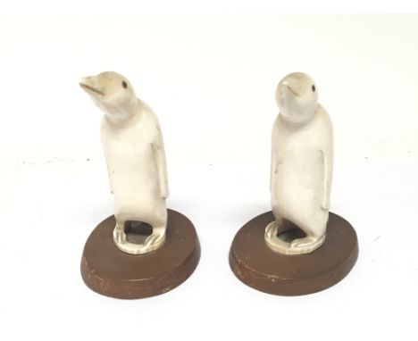 Two early 20th Century Inca tribe type carved marine ivory figures in the form of penguins. Height 12cm. (2)