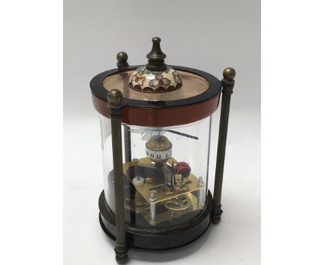 A small automaton clock with a dragonfly and a ladybird, approx height 16cm.
