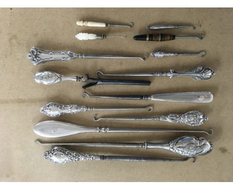 A collection of silver handled button hooks etc.