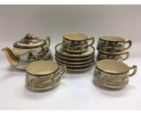 A Japanese tea service with giltwork decoration and painted with figures - NO RESERVE