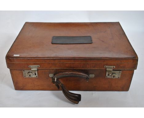A vintage leather suitcase with jade green moire silk lining and pouches for containers (no contents), to/w a smaller texture