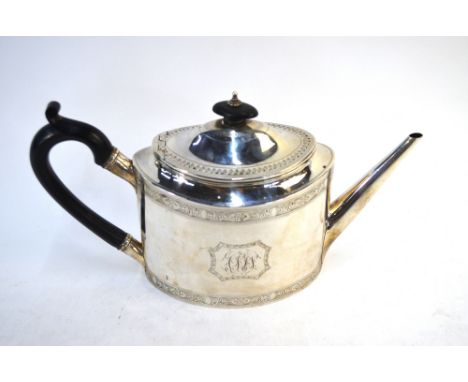 A George III silver teapot of elliptical form with straight tapering spout, engraved decoration and ebonised handle, Robert H