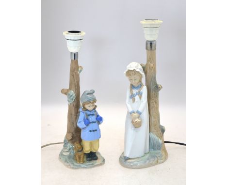 Two Nao lamp bases - one with a girl holding a basket, 30 cm high, the other with a boy in a duffle coat and beside a seated 