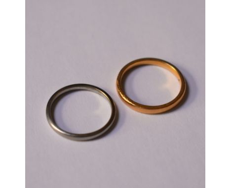 A 22ct yellow gold narrow wedding band, size K 1/2, approx 2.7g to/w an 18ct white gold narrow wedding band, size J 1/2, appr