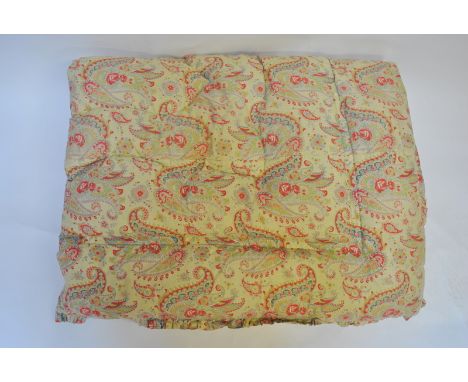 A pair of floral/paisley pale yellow ground vintage single eiderdowns, to/w a similar single eiderdown (3) One of pair of eid