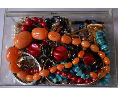 A quantity of vintage and later costume jewellery including simulated pearls, bead necklaces, gilt metal necklaces, hinged ba