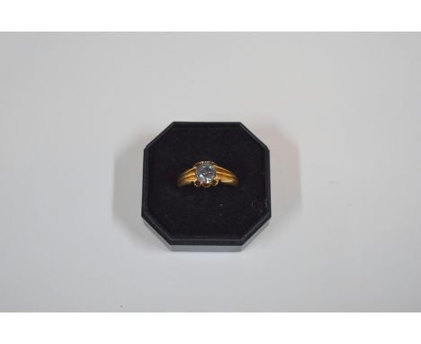 An 18ct yellow gold ring set with single stone rough diamond, ring size Q/R, approx 4.9g all in, diamond approx 0.769 carats