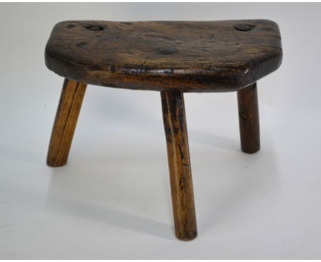 An antique elm seat tripod dairy stool, stamped with initials 'SR', 37 x 24 x 26 cm h