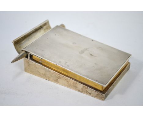 Asprey: an engine-turned silver notebook stand with propelling pencil, the sprung cover automatically lifting on pencil-extra