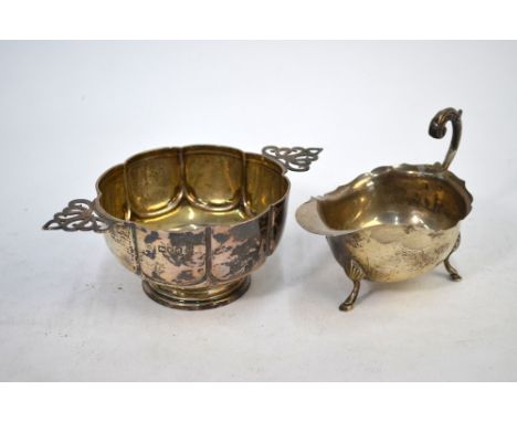 A late Victorian silver sugar basin of lobed form, with twin pierced handles and moulded foot, Samuel Walton Smith, London 18