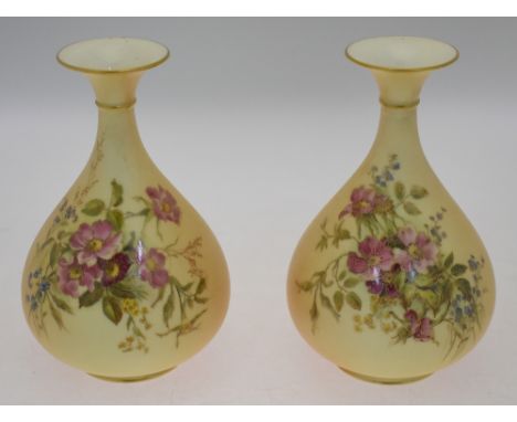 A pair of Royal Worcester blush ground floral decorated vases, date cypher 1912, shape 293, 19 cm high (2)Both good condition