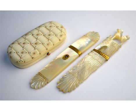 A Regency carved mother of pearl tooth-pick holder with shell-carved ends, gilt mounts and inset floral enamel plaque, anothe