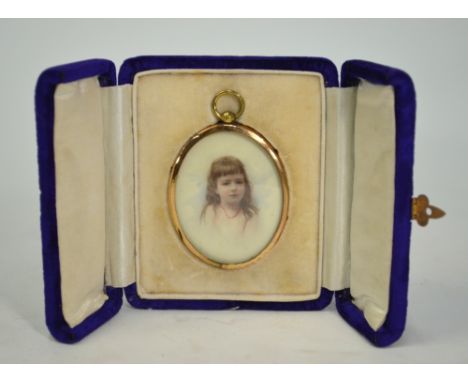 An oval portrait miniature on ivory of a young girl, in gilt metal frame, in silk-lined blue velvet case (circa 1900)