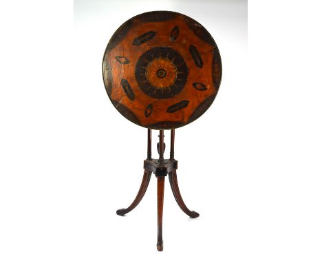 A George III inlaid satinwood tilt top wine table, the circular top centred by a batwing design and moth motif, with part lip