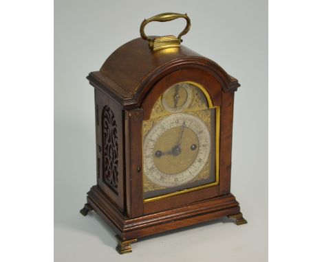 A George III &nbsp;twin fusee walnut cased mantel clock, the arched dial with gilt spandrels and silvered chapter ring, with 