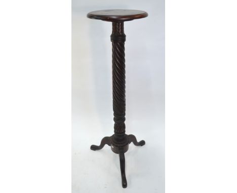 A Regency style mahogany tripod jardini&egrave;re stand, the spiral turned column on hip carved tripod legs, 130 cm high