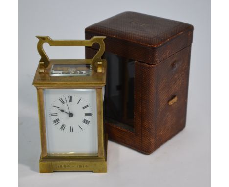 A brass carriage clock with single train 8-day movement and &nbsp;white enamelled dial, the case engraved 'From ....... 1894-
