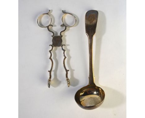 A pair of Georgian silver sugar nips of scrolling design, maker I M and assay marks only, to/w a fiddle pattern sauce ladle, 