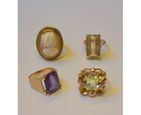 Four dress rings including rectangular pale citrine, size L, yellow metal set stamped 9ct; 1970s style rectangular synthetic 