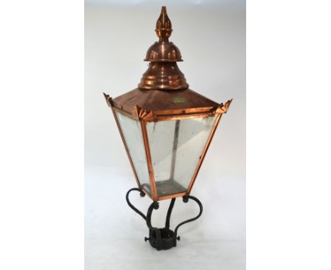 An antique cast iron street lamp post with large four panel copper lantern with ovoid maker plate 'D W Windsor NO 493'
