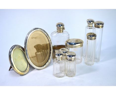 An Edwardian cut glass hip-flask with silver hinged bun cover and detachable beaker, Thomas Ingleton, London 1903, to/w&nbsp;