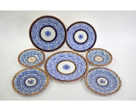 A collection of Worcester 'Royal Lily' pattern plates including an 18th century pair of plates with open crescent marks to ba
