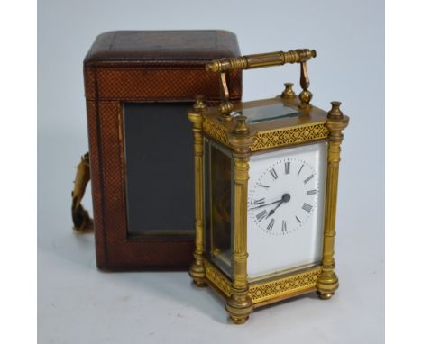 A Victorian Aesthetic period brass 8-day single train carriage clock, with enamelled dial, 13.5 cm h with leather travel case