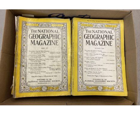A box of 36 vintage The National Geographic Magazines. Dating from 1940 through to 1963. 